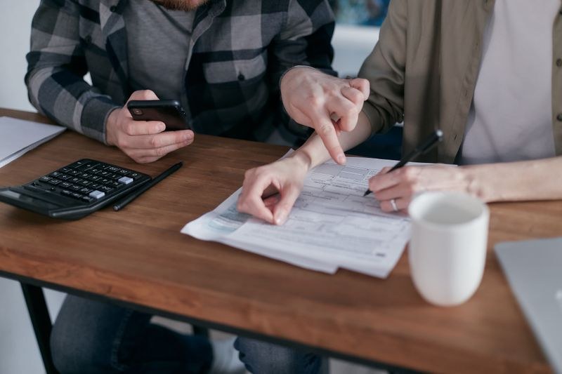 A couple reviewing a household budget together